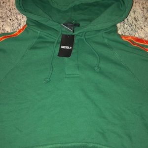 A green cropped hoodie
